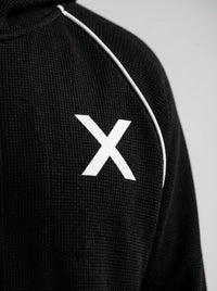 Zip-up waffle-knit hoodie — Fabric and Logo Detail | Generated by Modelize