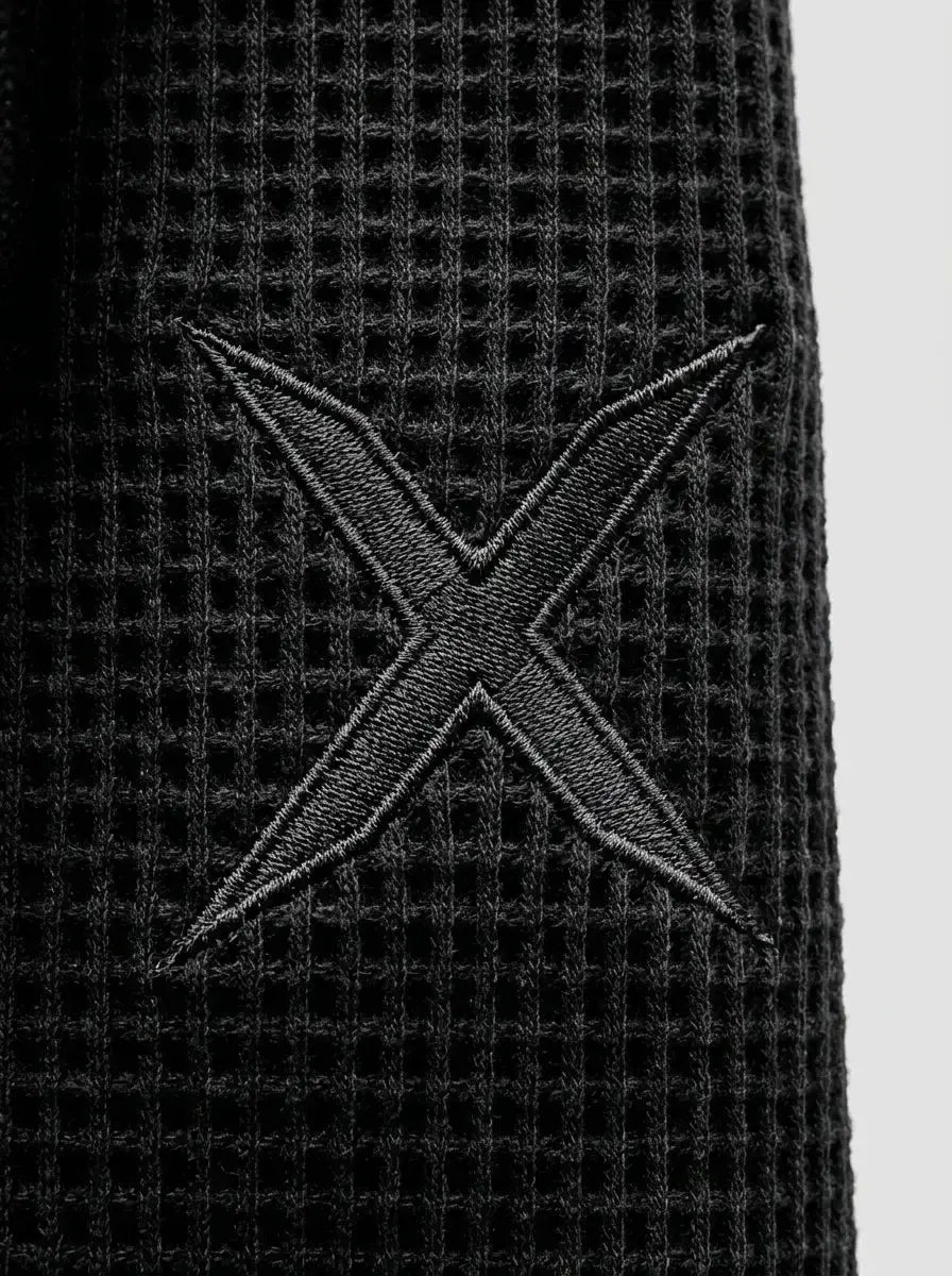 Barrel-cut waffle knit pants — Waffle Texture & Logo Detail | Generated by Modelize