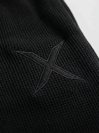 Barrel-leg sweatpants — Embroidered Crest and Collar Detail | Generated by Modelize
