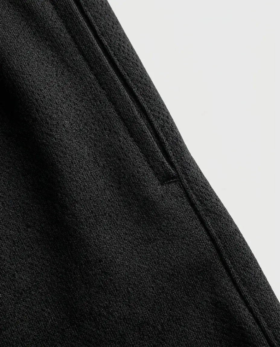 Men's athletic performance shorts — Technical Detail Close-up | Generated by Modelize