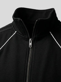 Raglan track jacket — Embroidered Crest and Collar Detail | Generated by Modelize